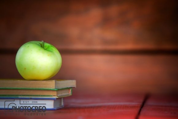 Apple on Books: A Versatile Visual for Education and Back-to-School Themes